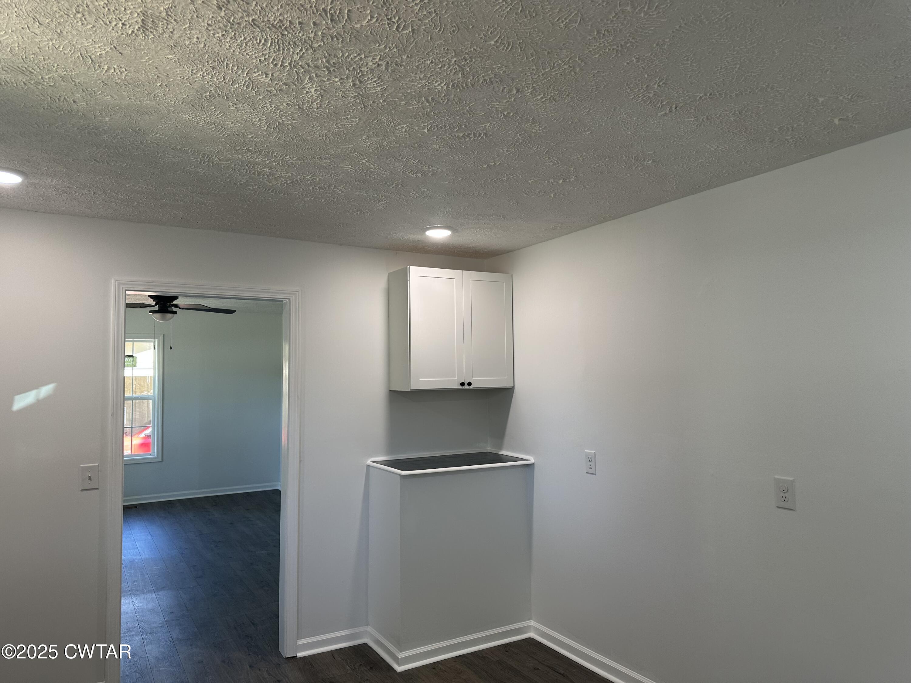 328 Baughn Street Henderson, TN 38340 - Photo 2 of 16 a view of an empty room and wooden floor
