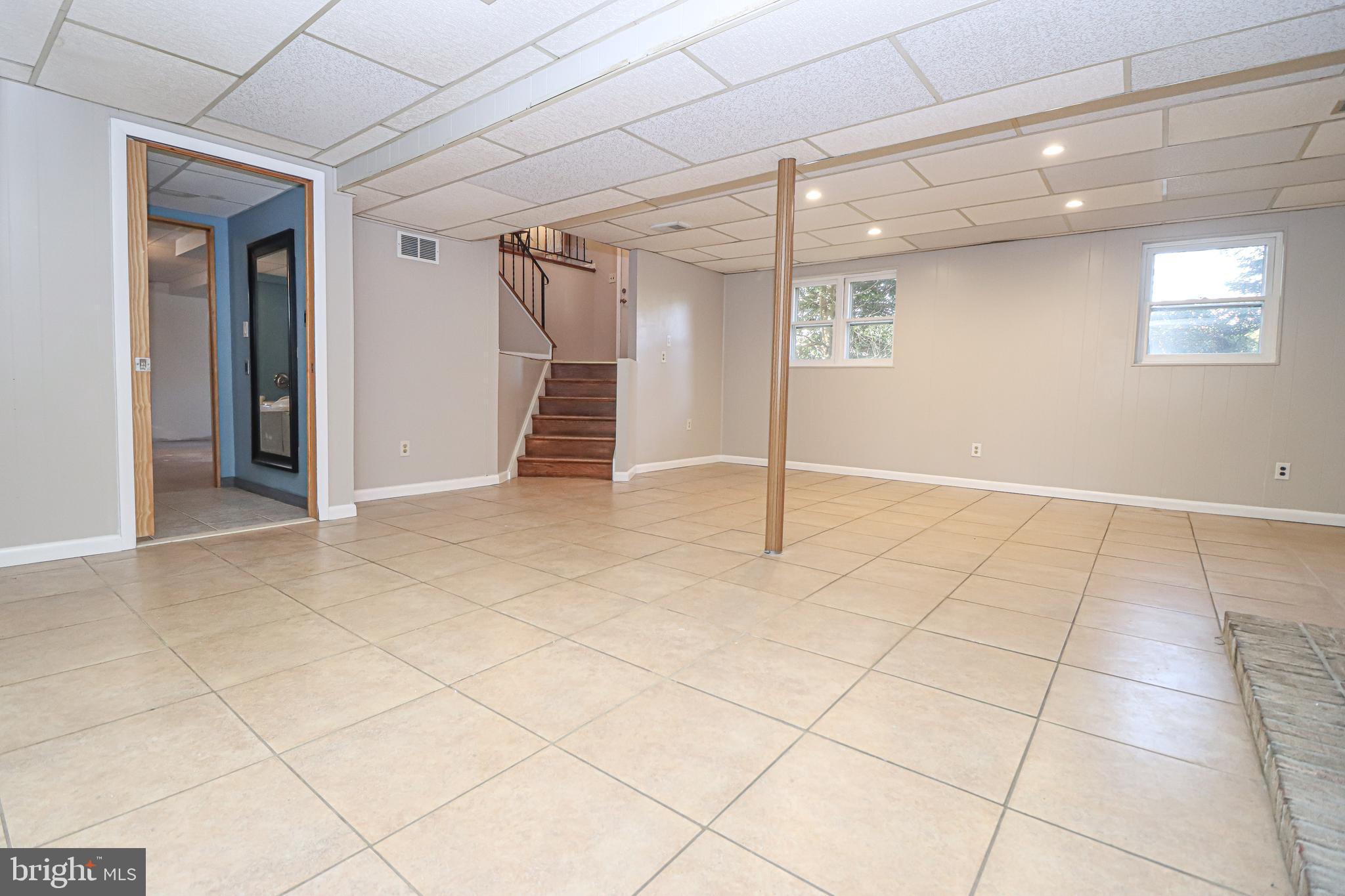 5929 Snowdens Run Road Sykesville, MD 21784 - Photo 28 of 54 Oak steps lead to the finished basement from foyer