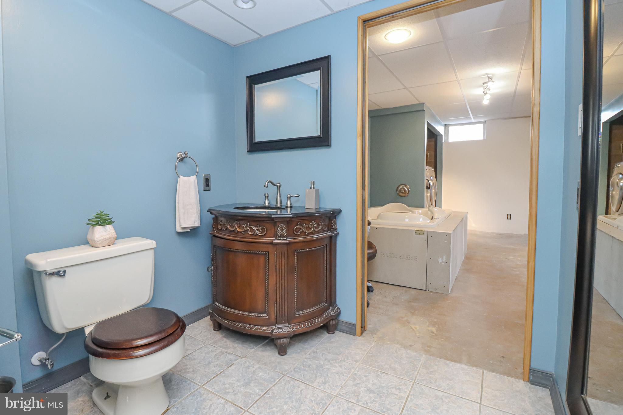 5929 Snowdens Run Road Sykesville, MD 21784 - Photo 29 of 54 3/4 Basement bathroom w/ pocket doors on ea. side