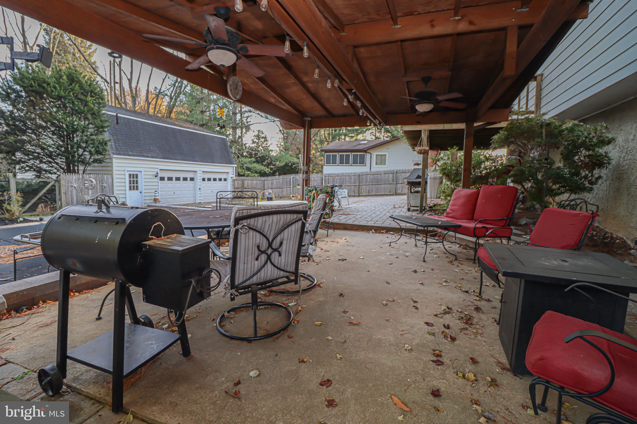5929 Snowdens Run Road Sykesville, MD 21784 - Photo 40 of 54 Covered Patio with outdoor lighting and fan