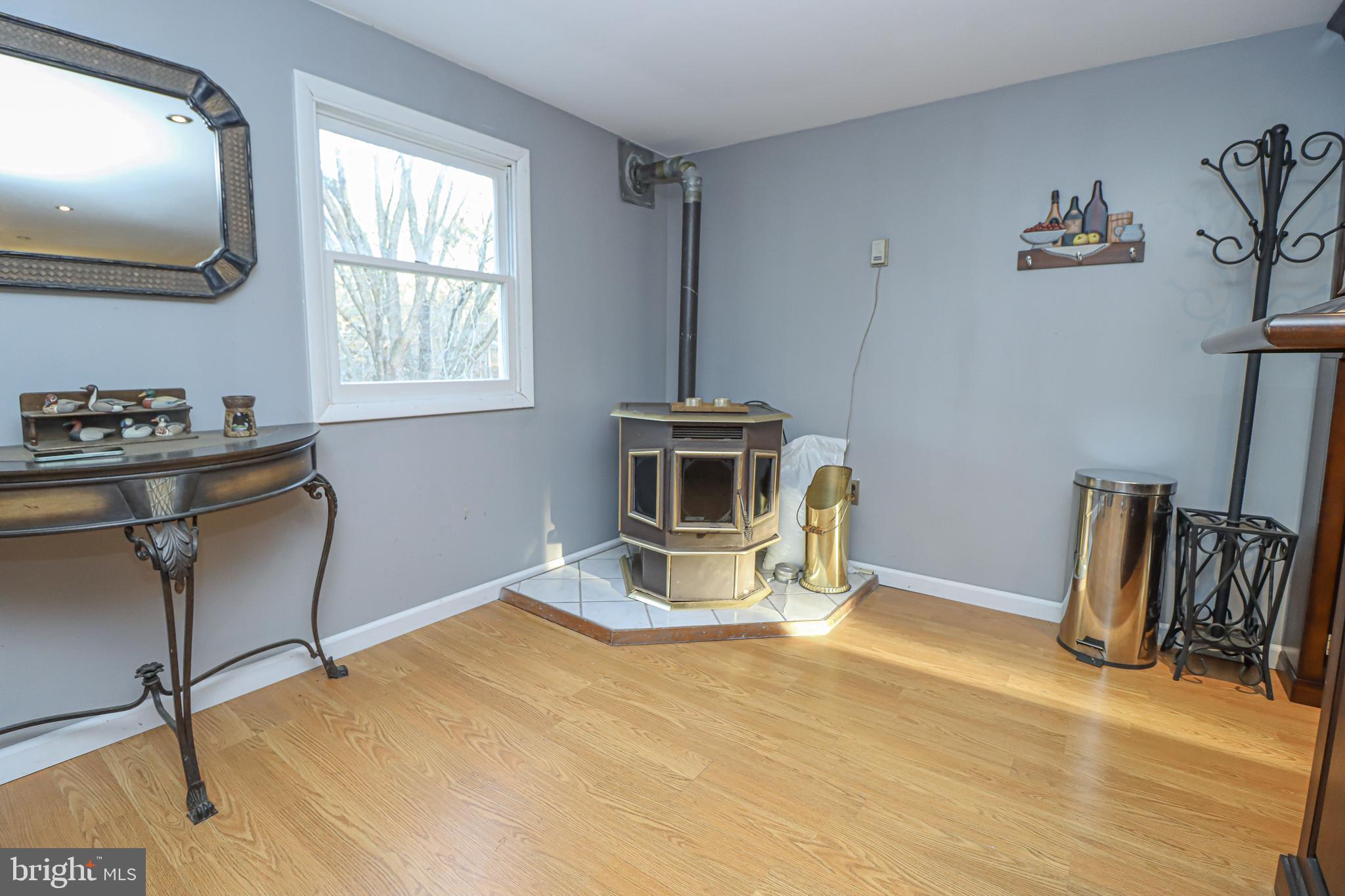 5929 Snowdens Run Road Sykesville, MD 21784 - Photo 47 of 54 Pellet stove provides heat to room over garage