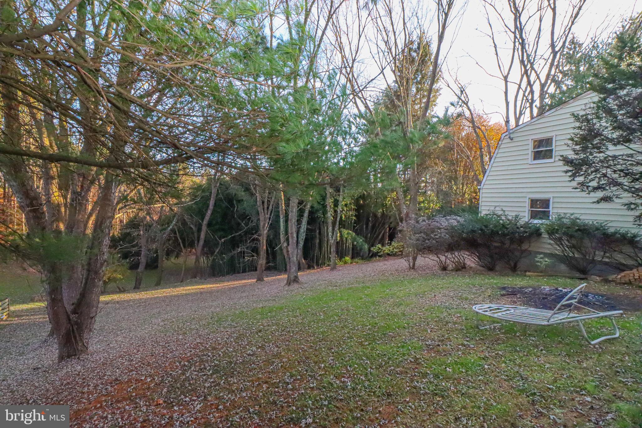 5929 Snowdens Run Road Sykesville, MD 21784 - Photo 51 of 54 Yard behind the fence looking at rear of garage