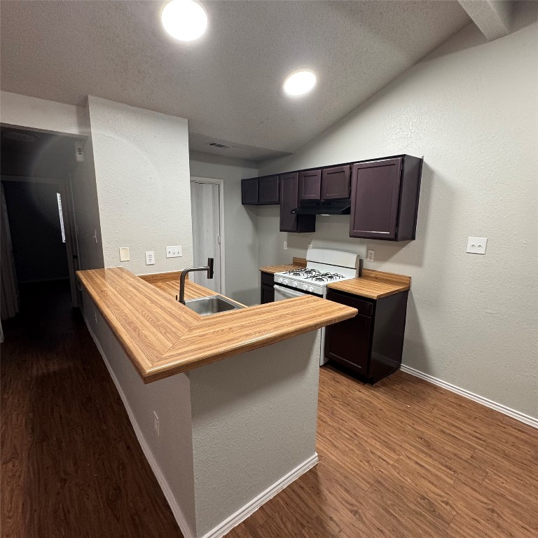 1212 Orchard Park Circle Pflugerville, TX 78660 - Photo 2 of 6 a kitchen with stainless steel appliances a sink and a refrigerator