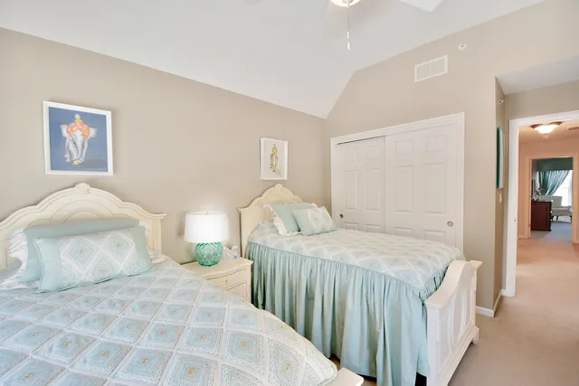 a bedroom with a bed and a mirror