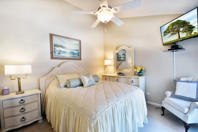 a bedroom with a bed and a couch