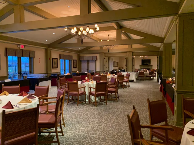 a view of a patio with dining table and chairs with a fire pit and a fire pit