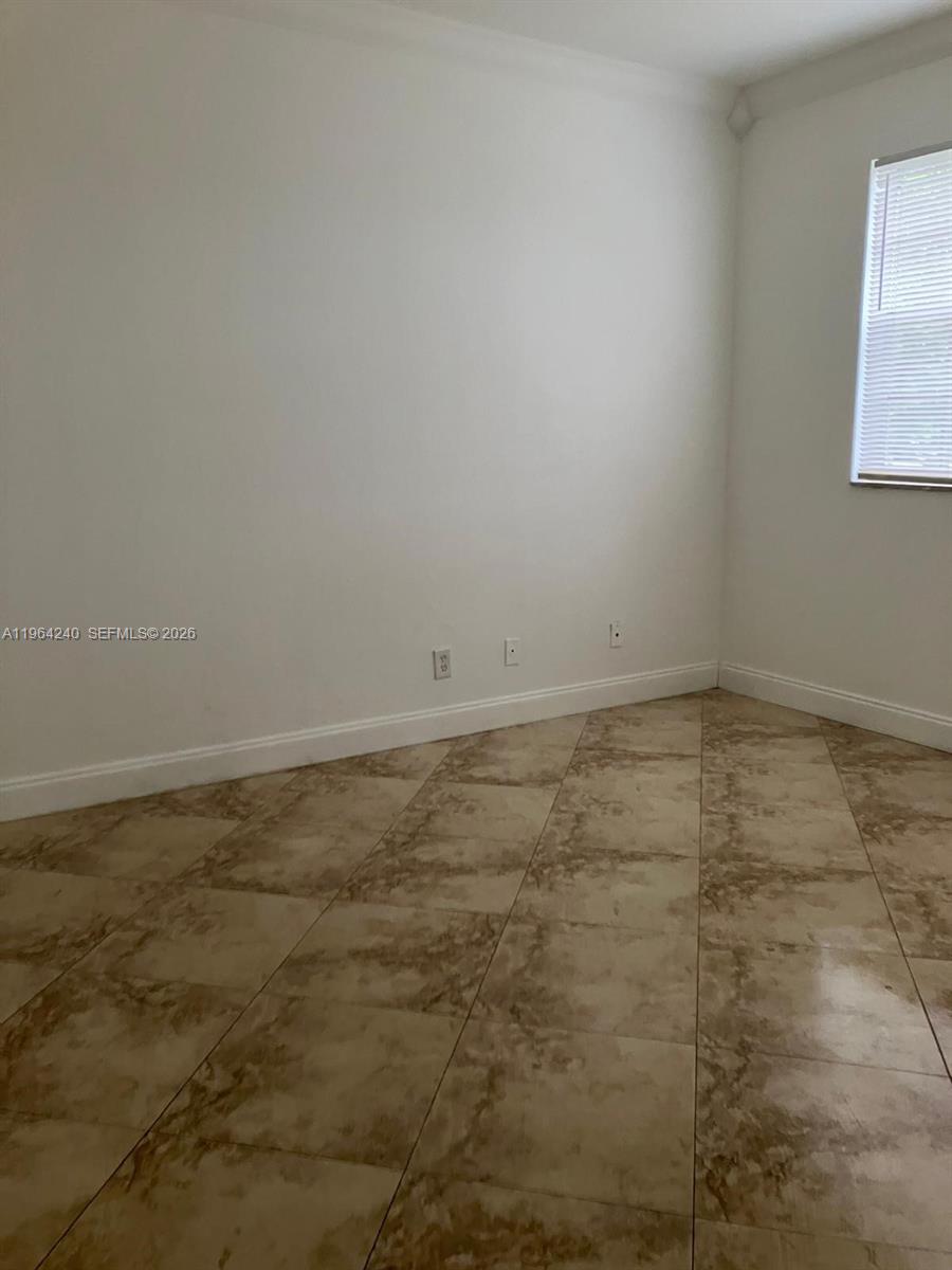 620 Cypress Club Way, Unit L13 Deerfield Beach, FL 33064 - Photo 9 of 14 a view of room with window