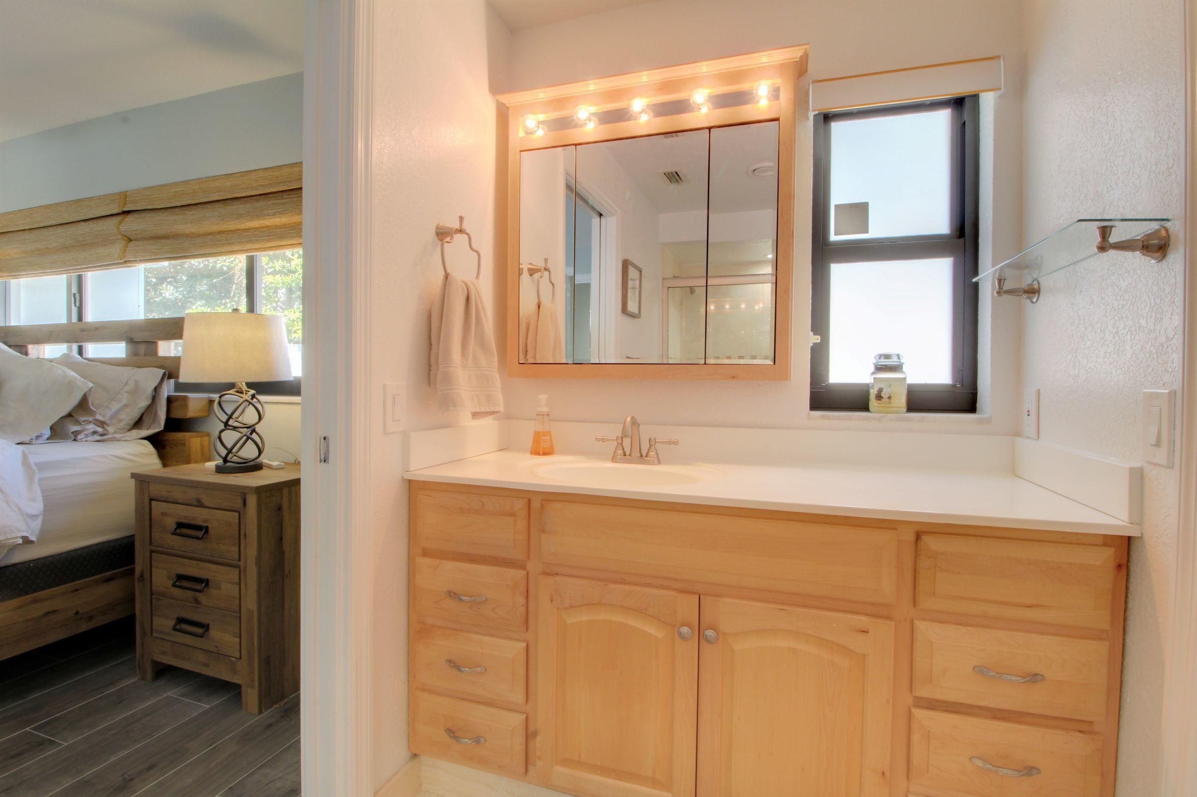 1501 Banyan Road Boca Raton, FL 33432 - Photo 12 of 26 a bathroom with a sink and a mirror