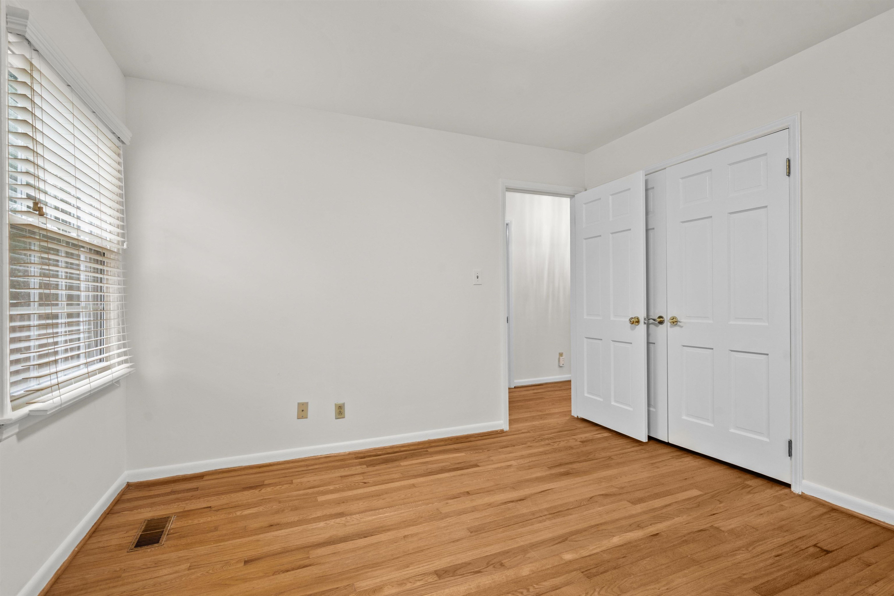 309 Glen Valley Road Raleigh, NC 27609 - Photo 26 of 34 Bedroom 3 has a standard closet and hardwood floors. Bedroom 3