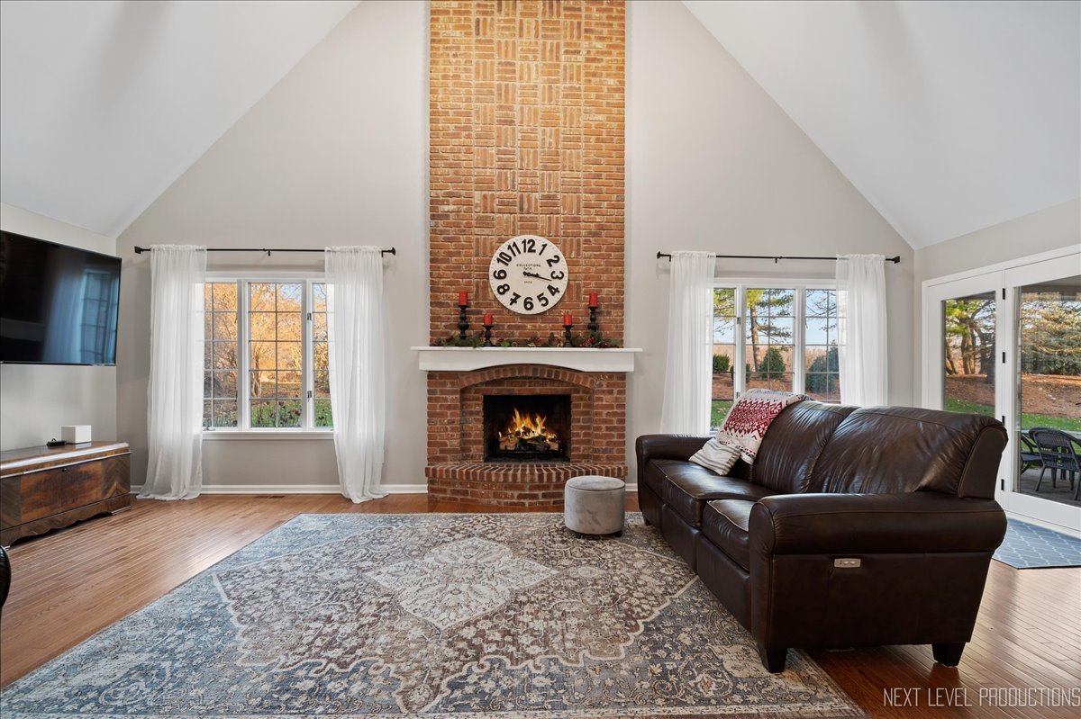 1521 Eagle Brook Drive Geneva, IL 60134 - Photo 13 of 41 a living room with furniture and a fireplace