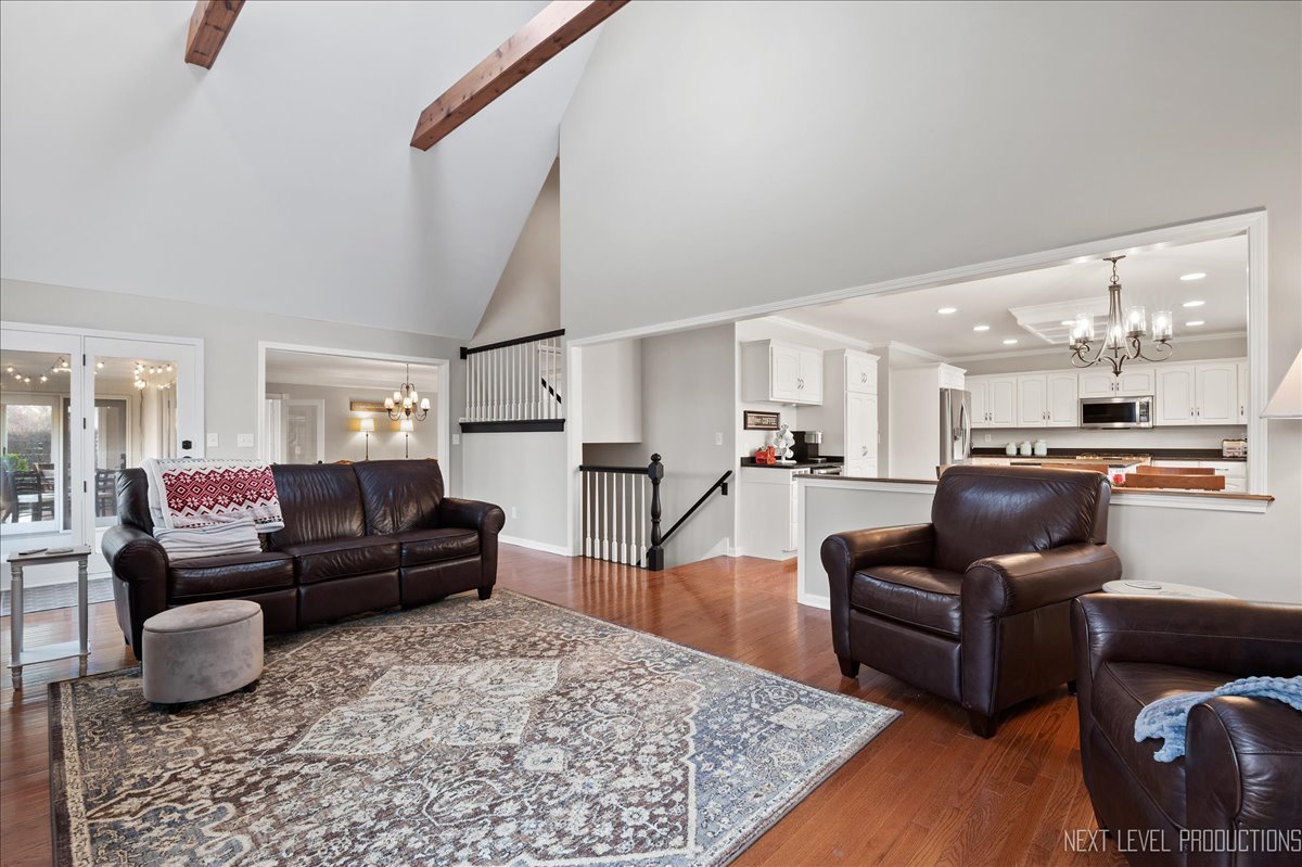 1521 Eagle Brook Drive Geneva, IL 60134 - Photo 16 of 41 a living room with furniture and a wooden floor