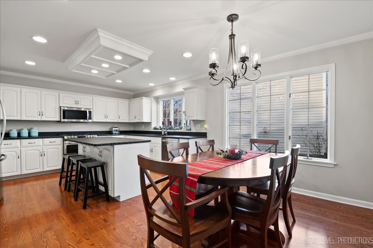 1521 Eagle Brook Drive Geneva, IL 60134 - Photo 17 of 41 a view of a dining room with furniture and wooden floor