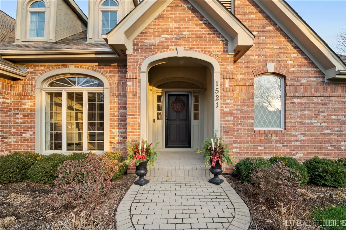 1521 Eagle Brook Drive Geneva, IL 60134 - Photo 2 of 41 a front view of a house with garden