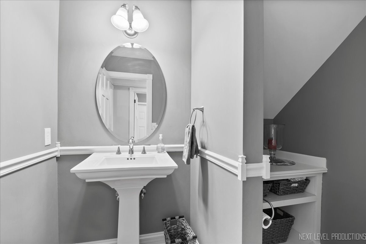 1521 Eagle Brook Drive Geneva, IL 60134 - Photo 26 of 41 a bathroom with a sink and a mirror