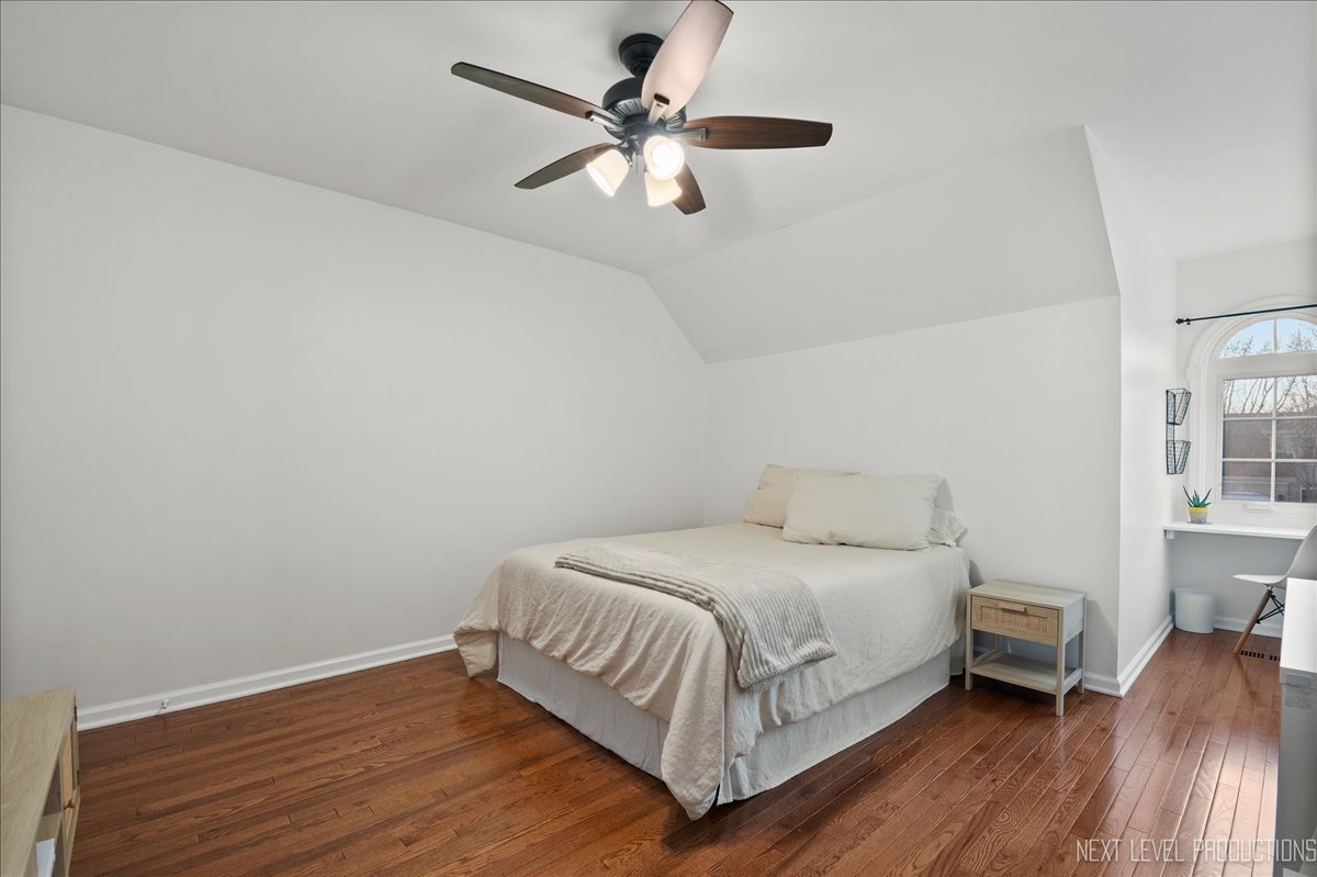 1521 Eagle Brook Drive Geneva, IL 60134 - Photo 31 of 41 a bedroom with a bed and a ceiling fan