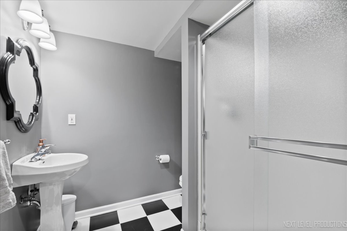 1521 Eagle Brook Drive Geneva, IL 60134 - Photo 35 of 41 a bathroom with a sink toilet and shower