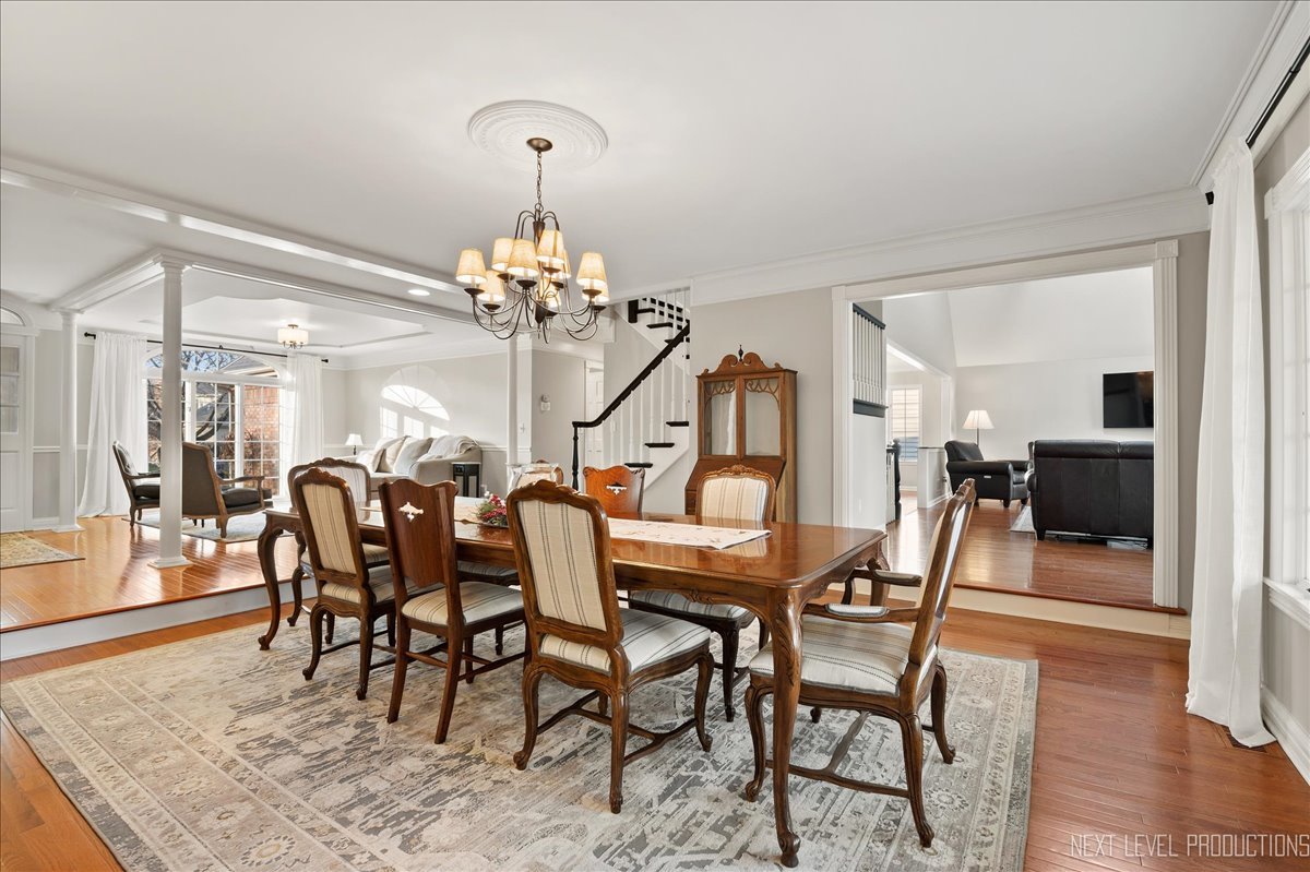 1521 Eagle Brook Drive Geneva, IL 60134 - Photo 10 of 41 a view of a dining room with furniture and wooden floor
