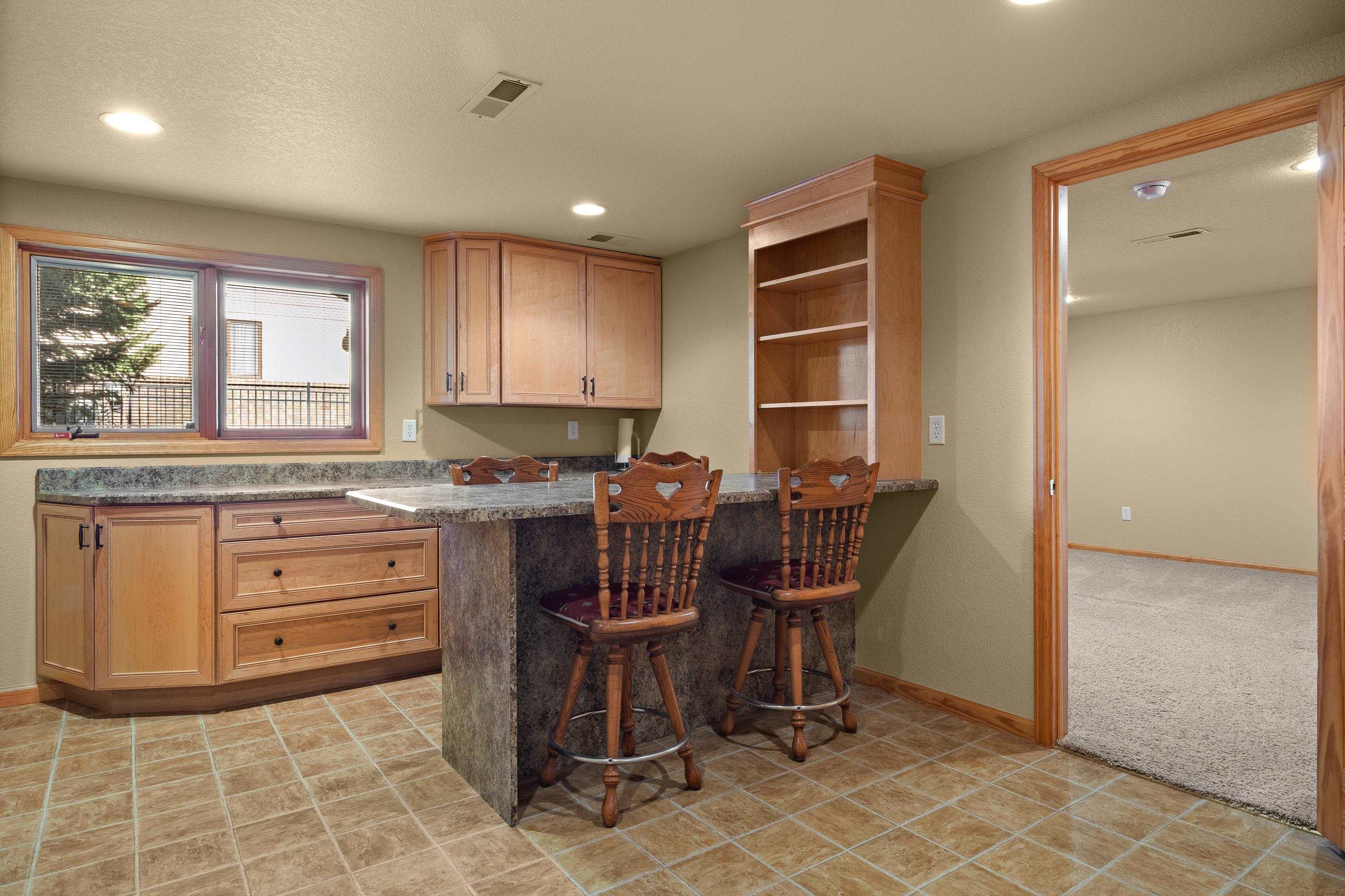 1920 Rustic Court Casper, WY 82609 - Photo 35 of 37 Loads of storage. Could be used as a guest/teen kitchenette area.