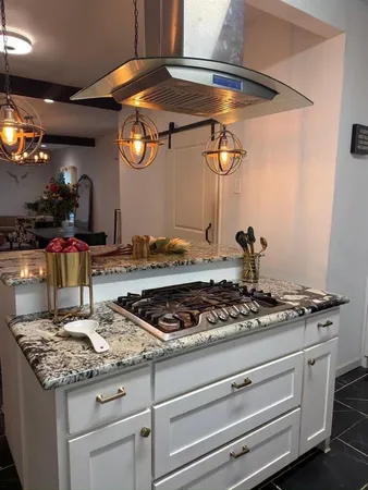 a kitchen with a stove and cabinets