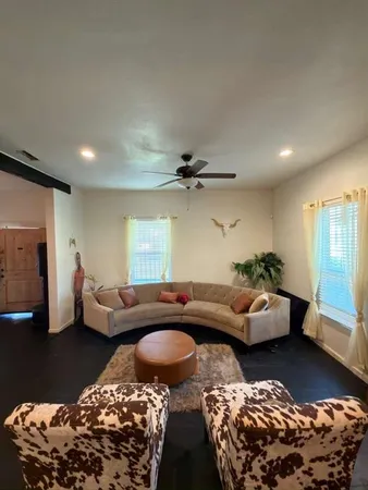 a living room with furniture and a rug