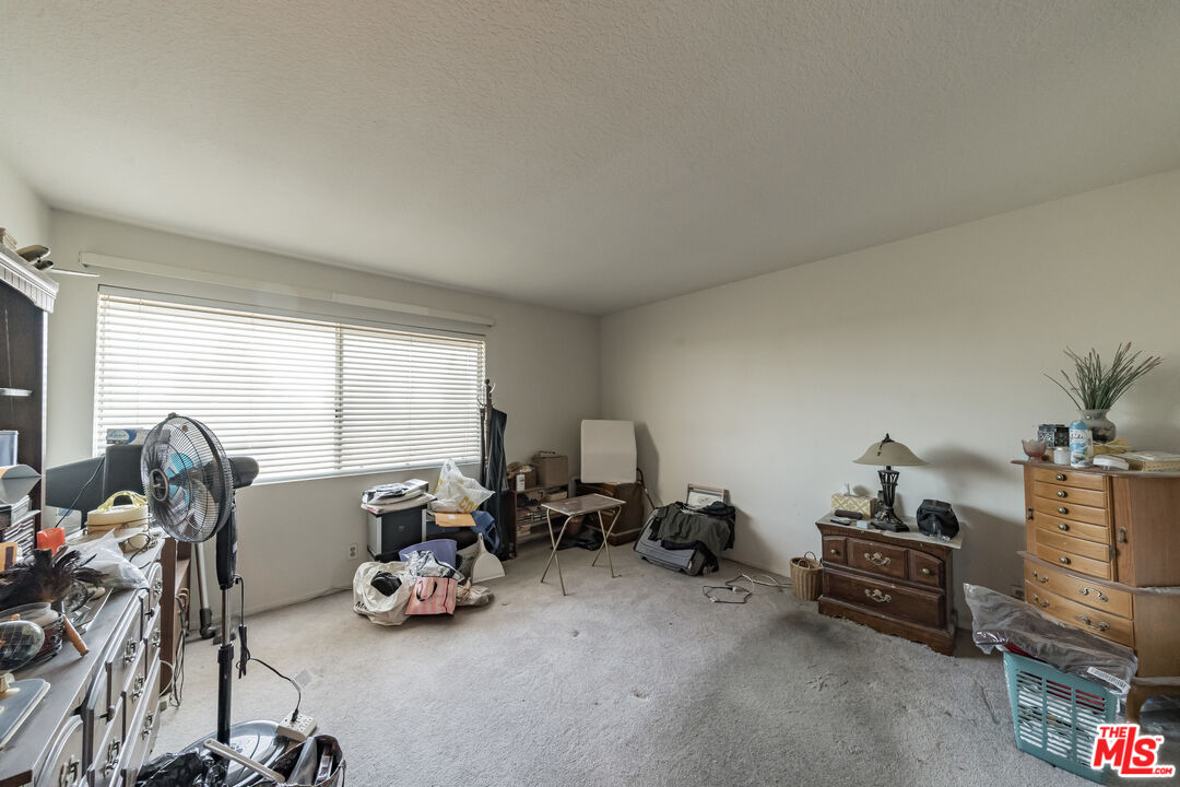 19127 Index Street, Unit 3 Porter Ranch, CA 91326 - Photo 12 of 18 a room with furniture and a window
