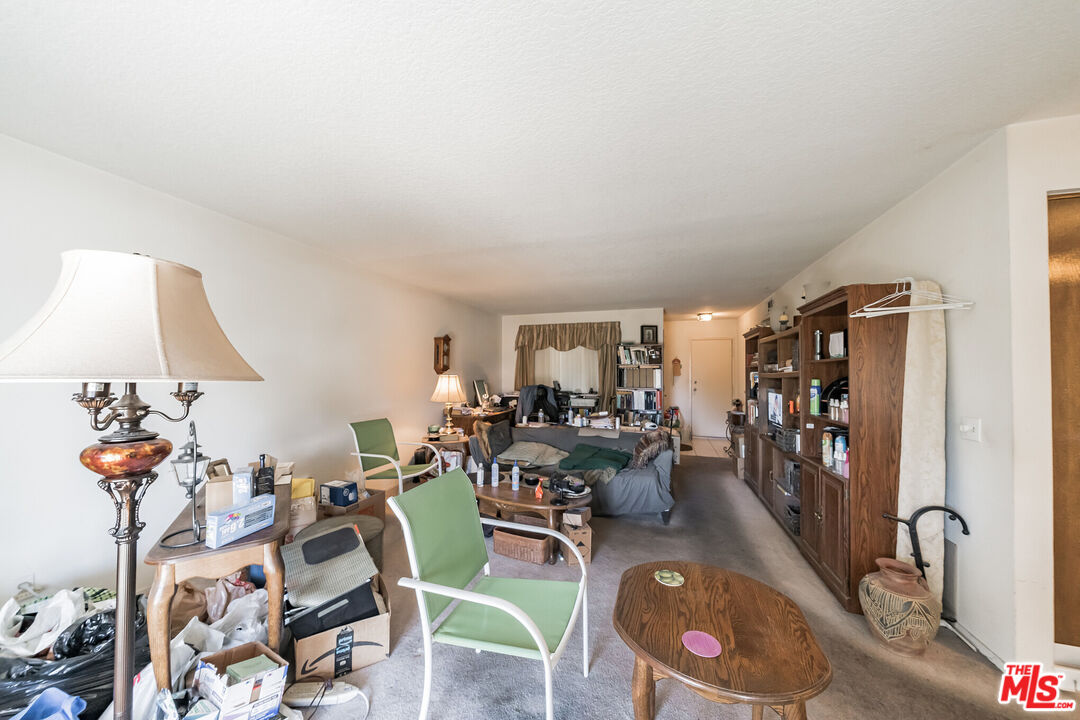 19127 Index Street, Unit 3 Porter Ranch, CA 91326 - Photo 13 of 18 a living room with furniture and a wooden floor