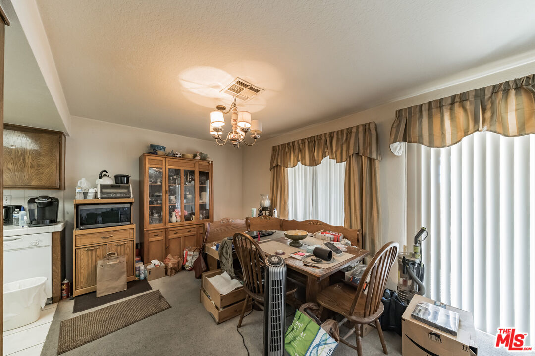 19127 Index Street, Unit 3 Porter Ranch, CA 91326 - Photo 14 of 18 a view of a livingroom with furniture and a window