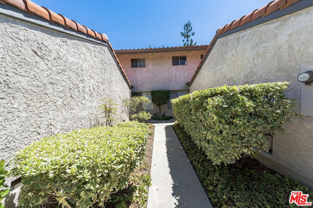 19127 Index Street, Unit 3 Porter Ranch, CA 91326 - Photo 17 of 18 a view of a backyard with pathway