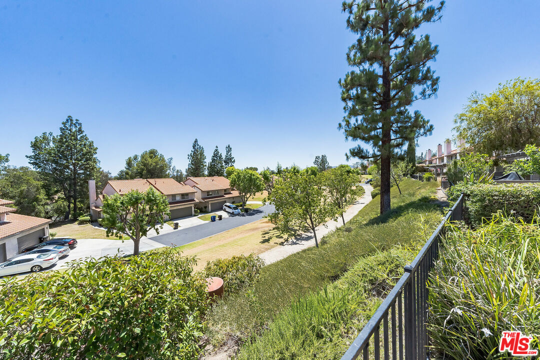19127 Index Street, Unit 3 Porter Ranch, CA 91326 - Photo 7 of 18 a view of a yard with flower plants