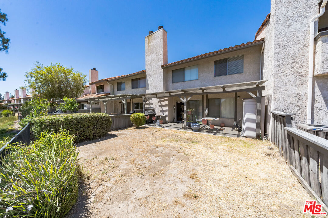 19127 Index Street, Unit 3 Porter Ranch, CA 91326 - Photo 8 of 18 a view of a house with backyard porch and furniture
