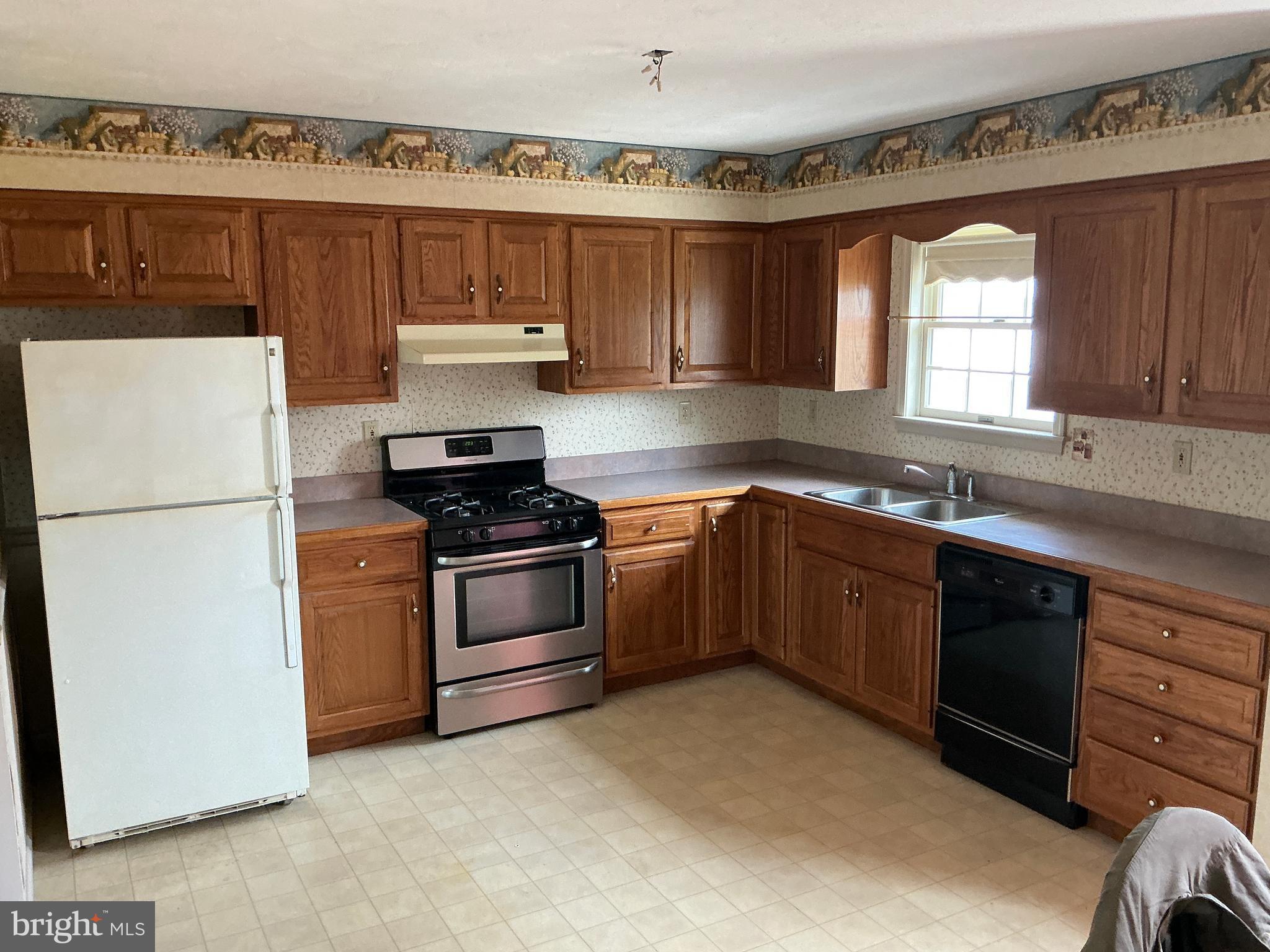 665 Game Lands Road Aspers, PA 17304 - Photo 15 of 40 a kitchen with a sink a stove and refrigerator