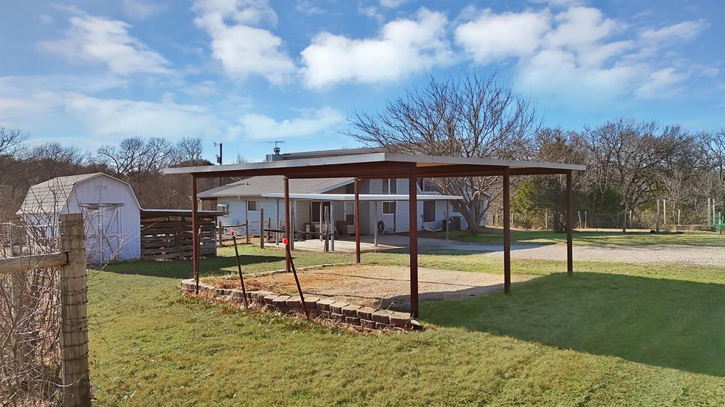 7320 Retta Mansfield Road Mansfield, TX 76063 - Photo 8 of 15 a view of a house with a yard