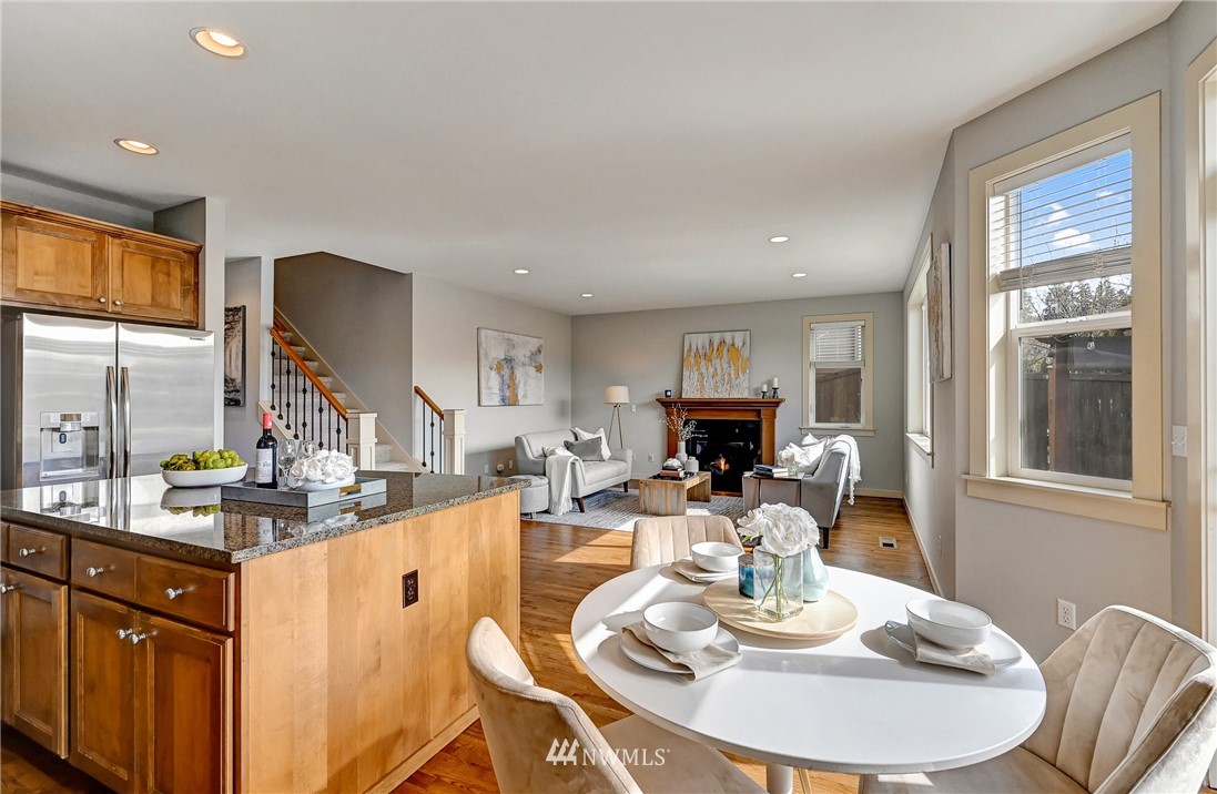 4022 167th Street Southeast Bothell, WA 98012 - Photo 11 of 34 a living room with fireplace furniture and a wooden floor