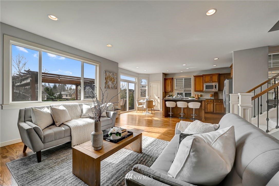 4022 167th Street Southeast Bothell, WA 98012 - Photo 12 of 34 a living room with furniture wooden floor and a large window