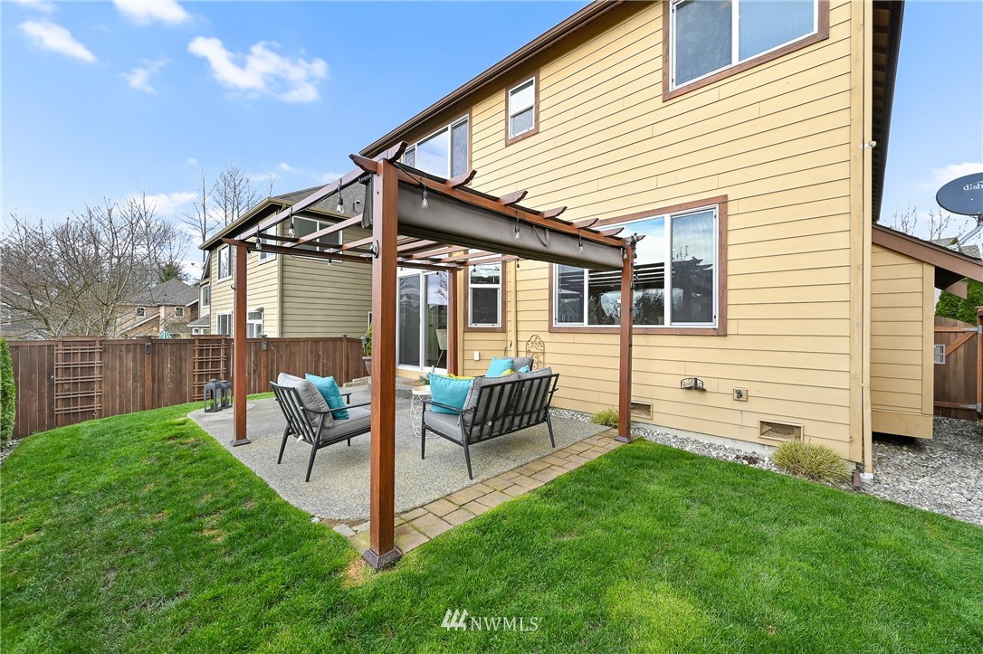4022 167th Street Southeast Bothell, WA 98012 - Photo 16 of 34 a view of a house with backyard and sitting area