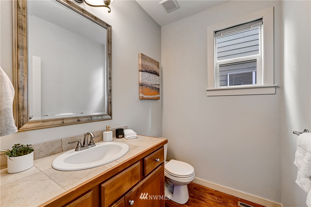 4022 167th Street Southeast Bothell, WA 98012 - Photo 18 of 34 a bathroom with a granite countertop sink and a mirror
