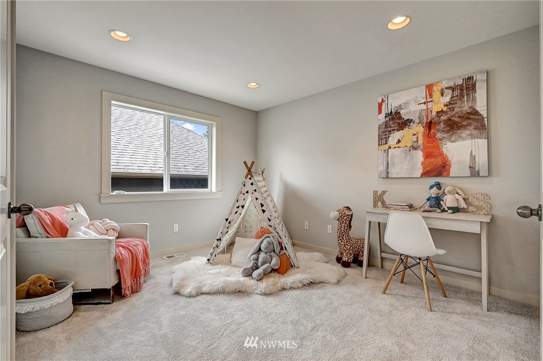 4022 167th Street Southeast Bothell, WA 98012 - Photo 26 of 34 a bedroom with furniture and a window