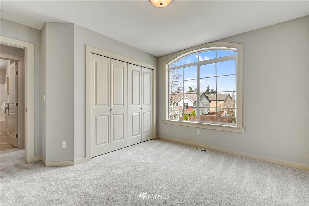 4022 167th Street Southeast Bothell, WA 98012 - Photo 27 of 34 an empty room with windows and closet