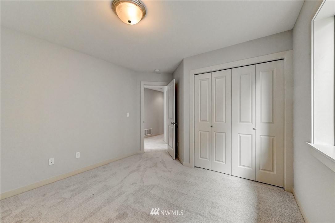 4022 167th Street Southeast Bothell, WA 98012 - Photo 29 of 34 an empty room with closet and window