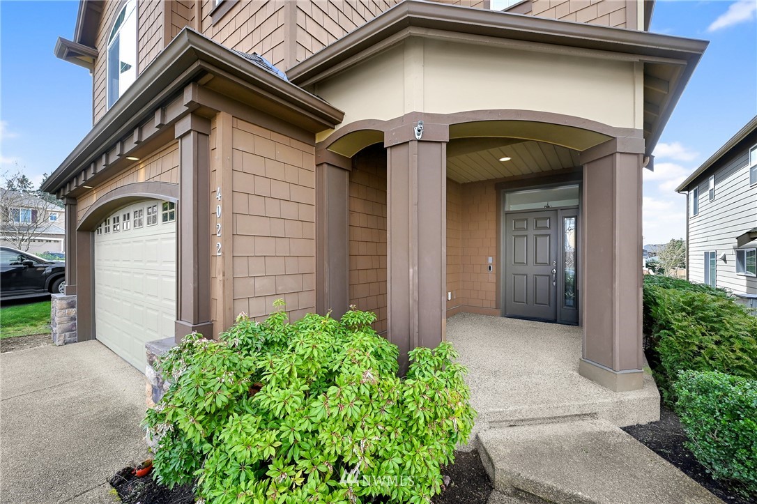 4022 167th Street Southeast Bothell, WA 98012 - Photo 3 of 34 a front view of a house with garden