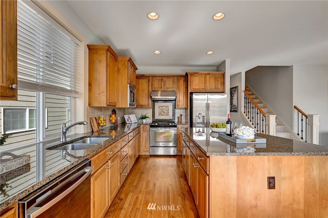 4022 167th Street Southeast Bothell, WA 98012 - Photo 9 of 34 a kitchen with counter top space a sink and appliances
