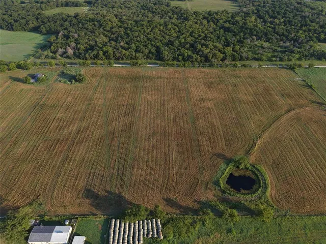 a view of swimming pool with outdoor seating and lake view