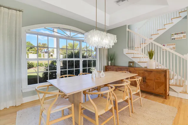 a view of a dining room with furniture window and outside view