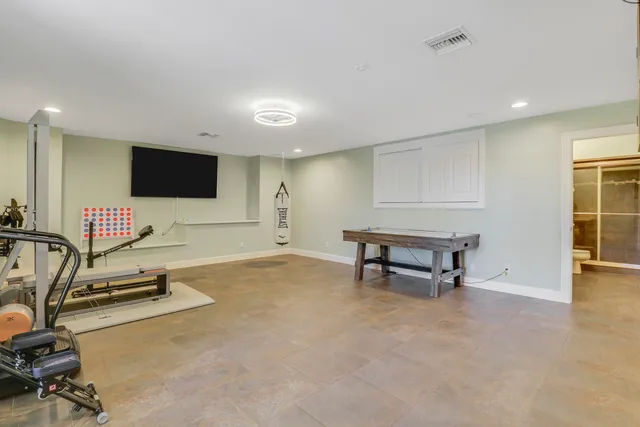 a view of a livingroom with furniture and a flat screen tv