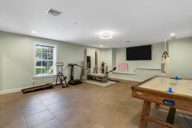 a bathroom with a granite countertop sink a toilet and shower