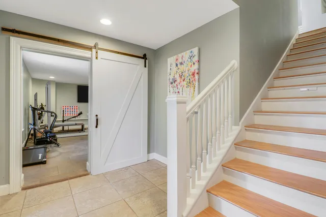 a living room with couches a coffee table and with outer view