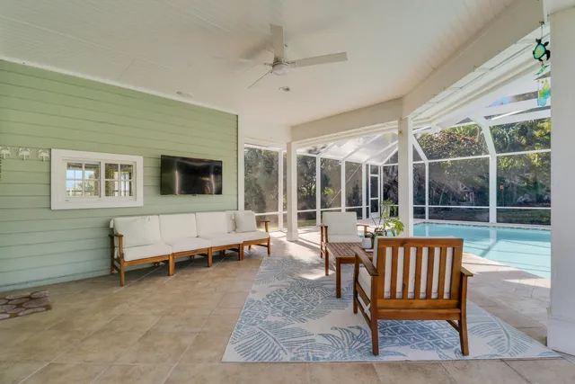 a view of a house with a backyard and porch
