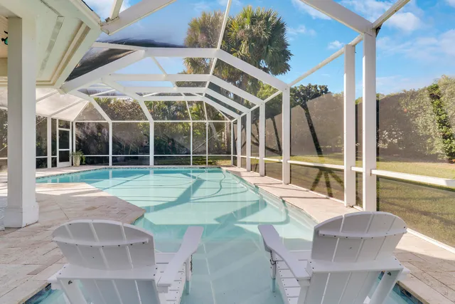 a view of a swimming pool with a porch