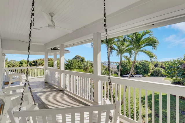 a view of a balcony with furniture