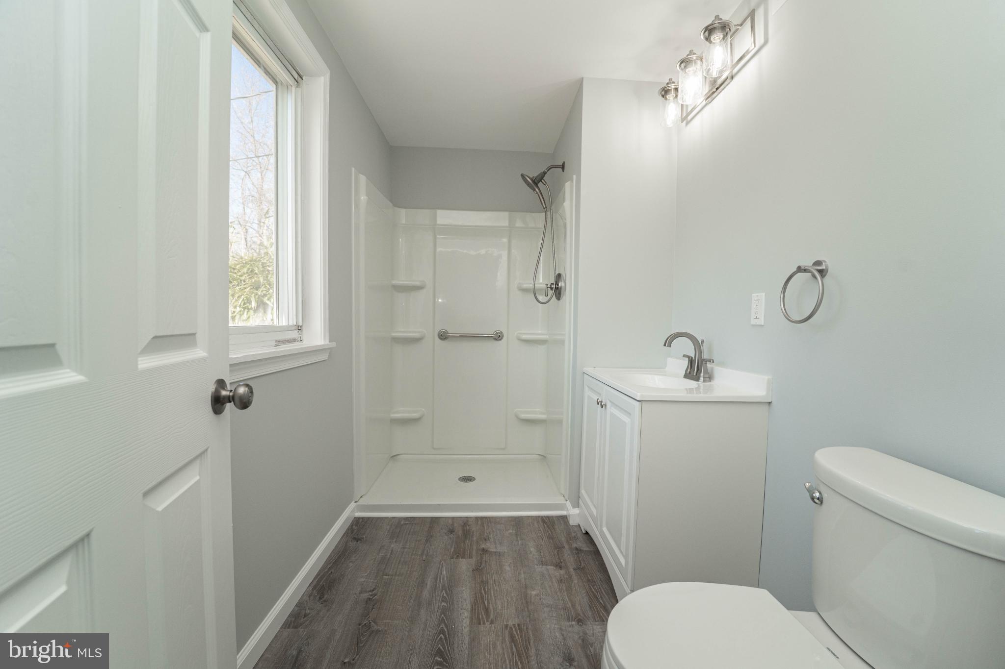 5312 Catalpha Road Baltimore, MD 21214 - Photo 22 of 59 a bathroom with a toilet sink and shower